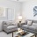 a living room with a couch and a fan