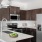 a kitchen with a white counter top and a white refrigerator