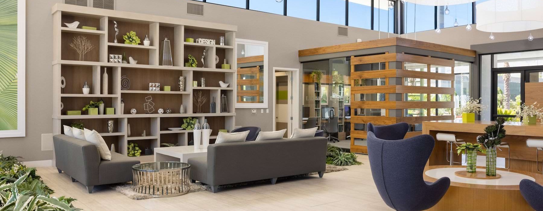 large clubhouse with seating windows and a bookshelf