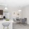 a kitchen with a dining table and chairs