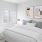 a bedroom with a fan and a bed