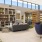 a room with a couch and bookshelves