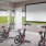 a room with bikes and a projector screen